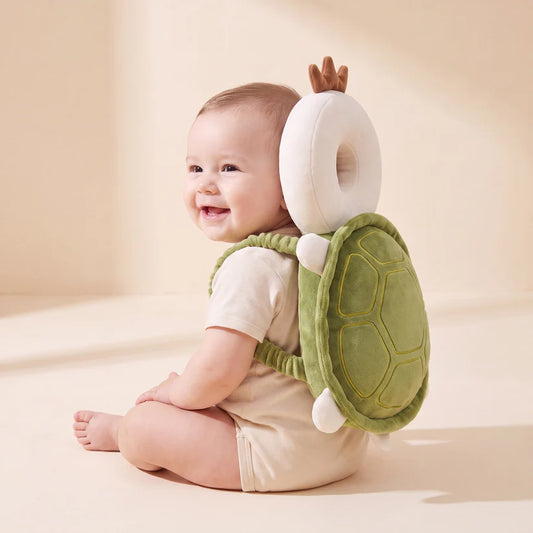 Baby wearing the turtle-style padded cushion backpack during supervised floor play